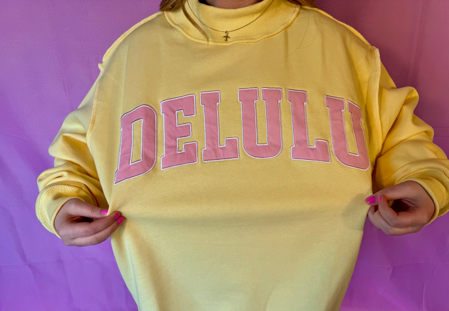 DELULU 'DELULU' Embroidered Mock Neck Sweatshirt